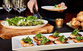 plated salad and salmon entrée